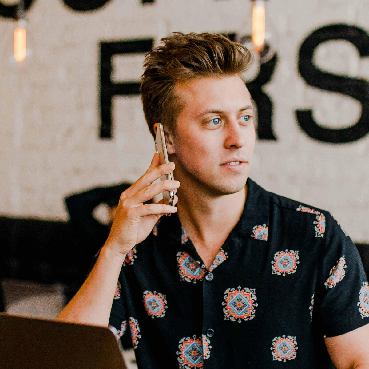 Young man on a business phone call.