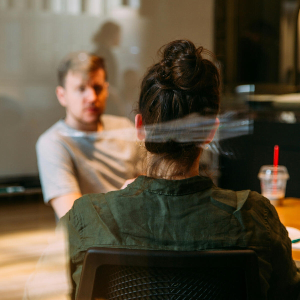 Two people sitting in a consultancy meeting.